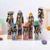 A collection of natural crystal wishing bottles filled with various raw stones and minerals.
