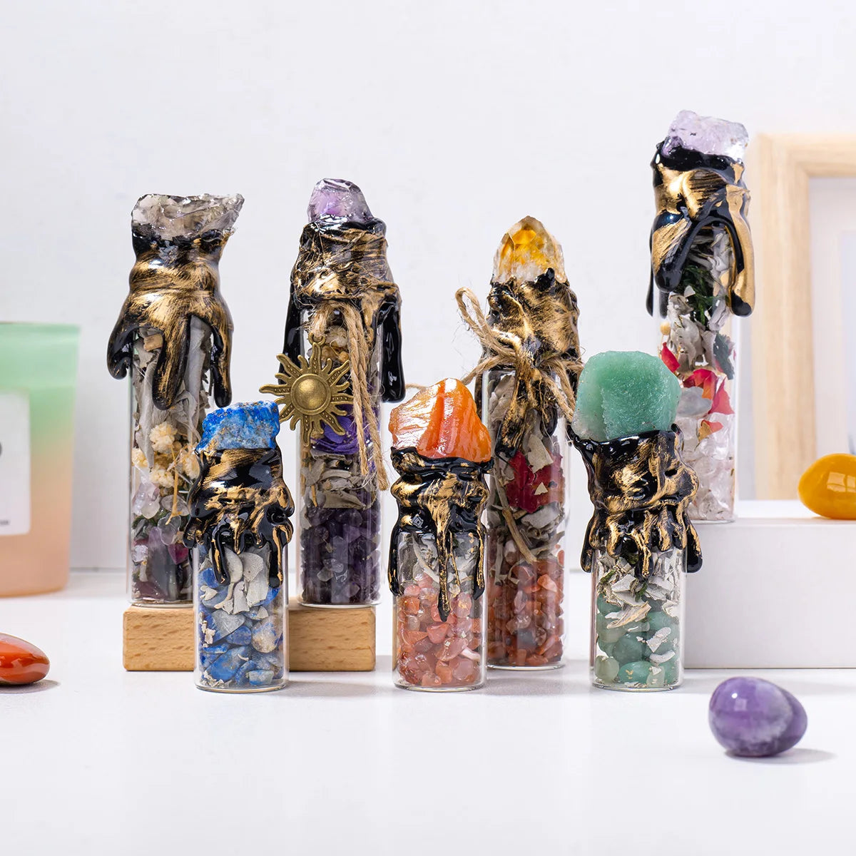 A collection of natural crystal wishing bottles filled with various raw stones and minerals.