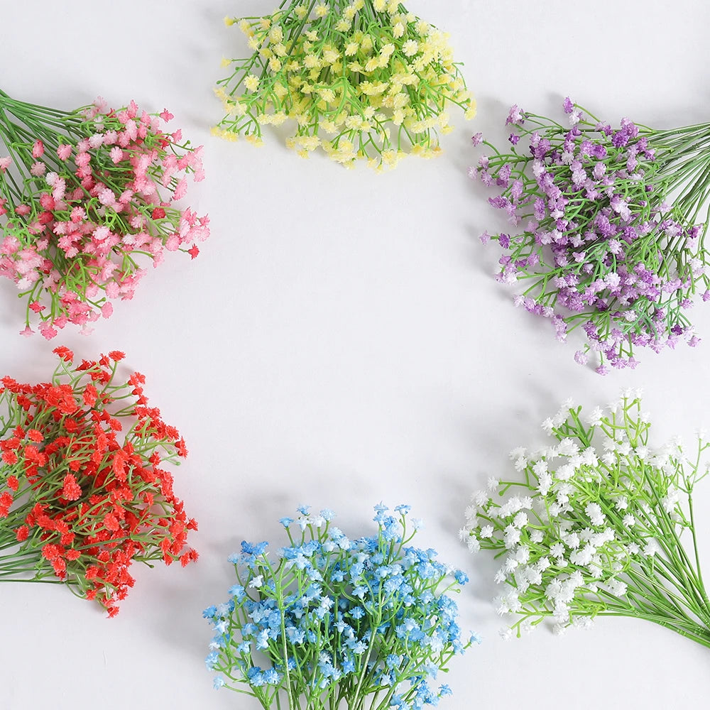 A circular arrangement of artificial baby's breath flowers in various shades of pink, purple, yellow, and green.