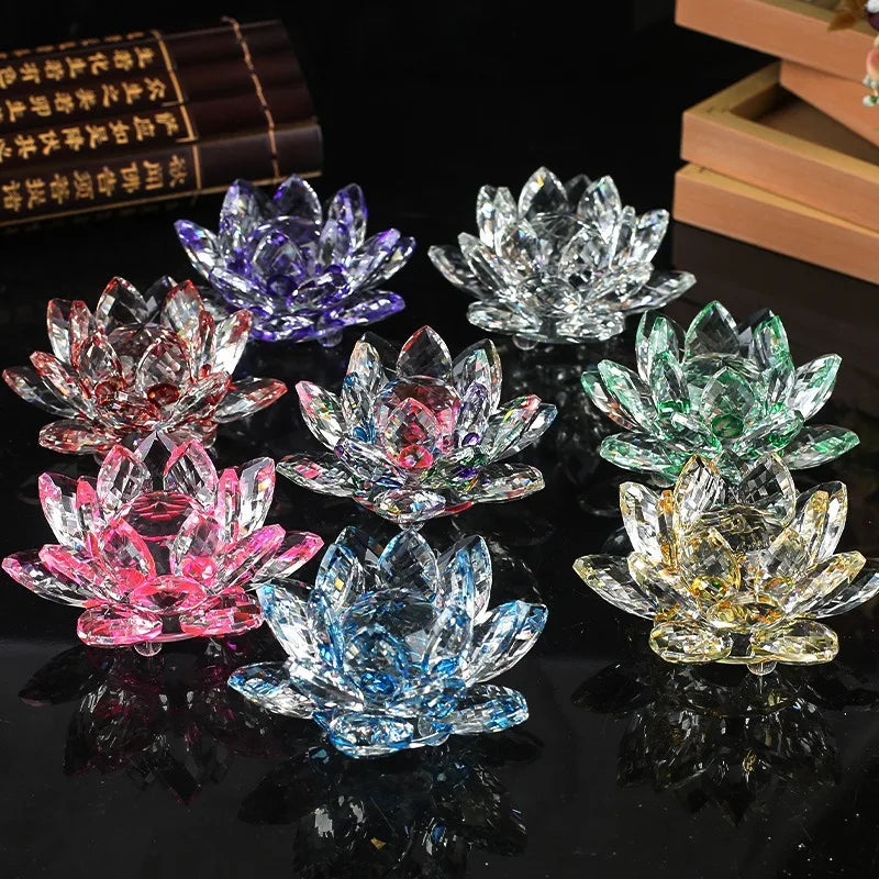 A collection of colorful crystal lotus flower ornaments displayed on a dark surface.