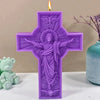 A purple silicone candle mold shaped like a crucifix featuring a depiction of Jesus Christ with outstretched arms and a flame