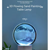A 3D flowing sand painting lamp displays a swirling blue wave pattern on a circular glass surface.