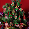 A festive arrangement of mini wooden candy cane Christmas ornaments in red, white, and green on a green fir tree.