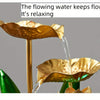 A golden flower-shaped fountain pours water, creating a relaxing flow effect.