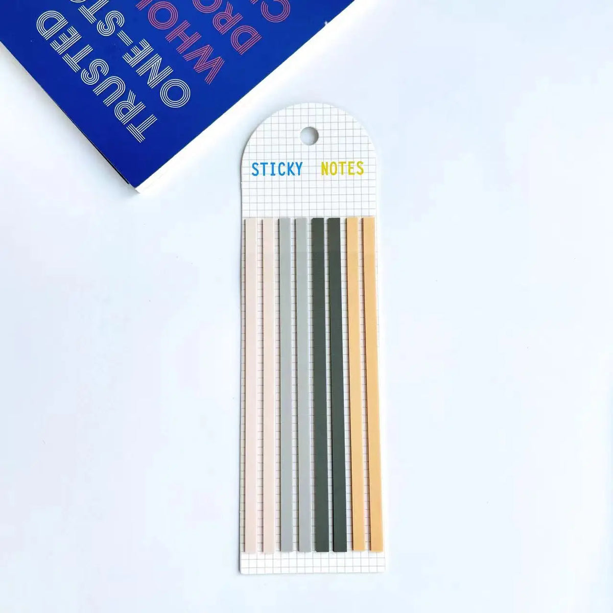 A pack of sticky notes with various colored strips for writing and indexing.