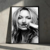 Black and white portrait of a woman with long blonde hair touching her lips