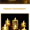 A group of golden LED crystal candles with realistic flickering light placed on a dark wooden surface.