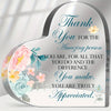 A heart-shaped acrylic sign with floral designs and the text Thank You for the amazing person you are for all that you do and
