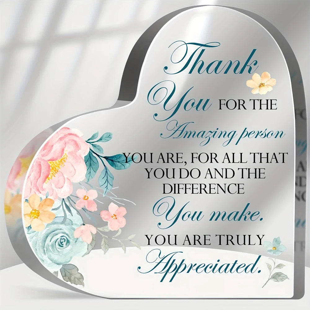 A heart-shaped acrylic sign with floral designs and the text Thank You for the amazing person you are for all that you do and