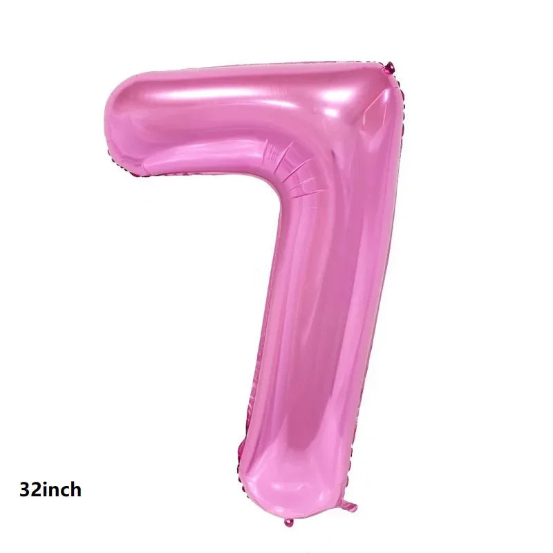 A pink latex balloon shaped like the number seven, measuring 32 inches.