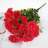 A bouquet of bright red artificial pansy flowers with green eucalyptus stems on white paper.