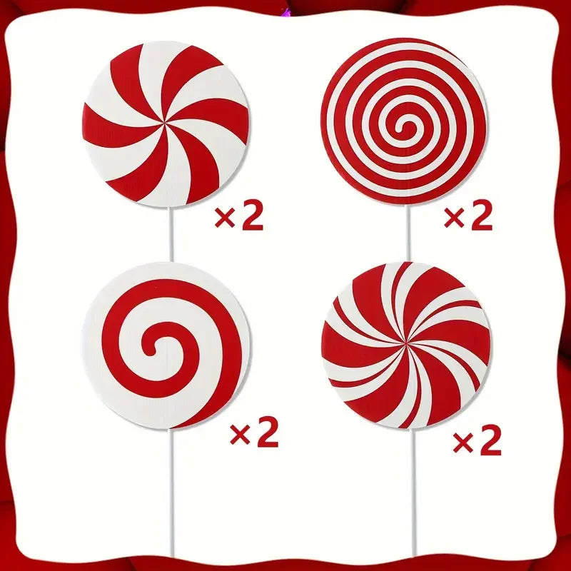 Four peppermint swirl Christmas tree toppers in red and white on a white background.