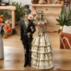 A resin figurine depicting a gothic skeleton couple, featuring a black and white dressed figure.