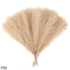 A bundle of light beige artificial pampas grass reeds used for home and event decor.