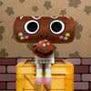 A brown plush toy with large eyes and stars is displayed on a yellow wooden box.