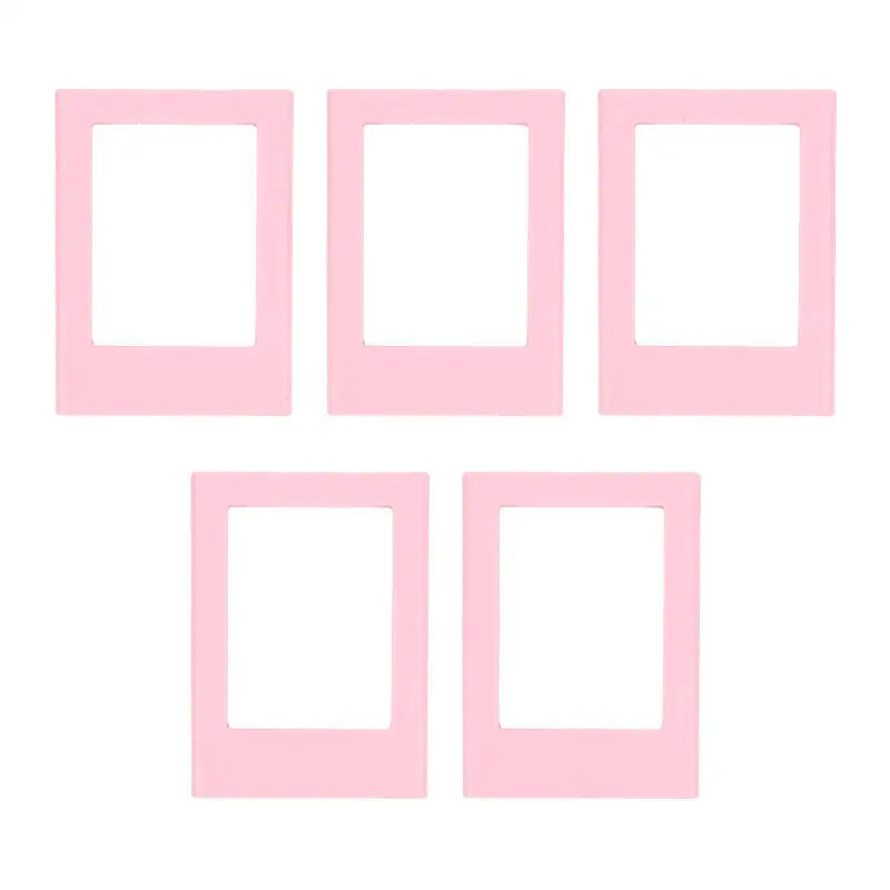 A set of five pink rectangular photo frame magnets.