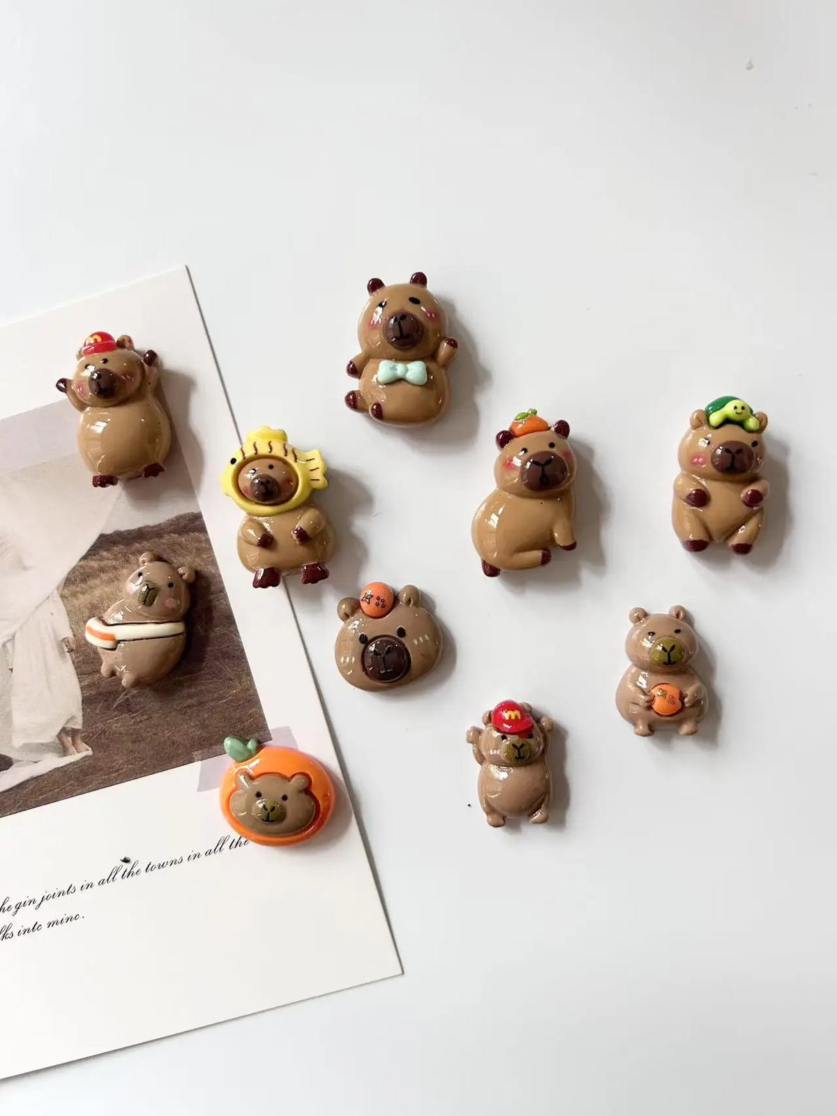 A set of adorable guinea pig refrigerator magnets in various shades of brown and orange.