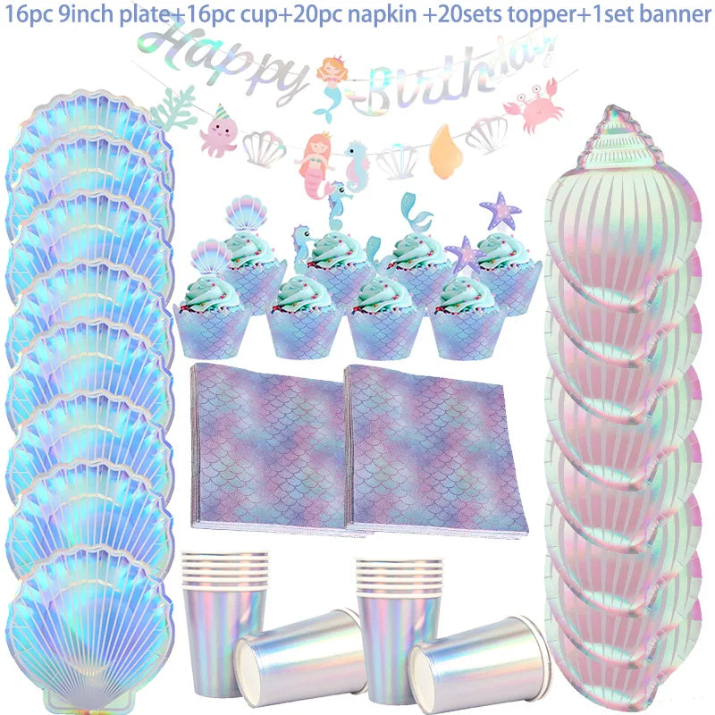 A set of iridescent pink and purple mermaid themed tableware including plates, cups, napkins, toppers, and a banner.