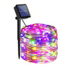A bundle of colorful LED string lights coiled on a black wire, with a solar panel attached to the end.