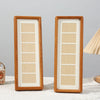 Two vertical solid wood photo frames with light wood panels displayed side by side.