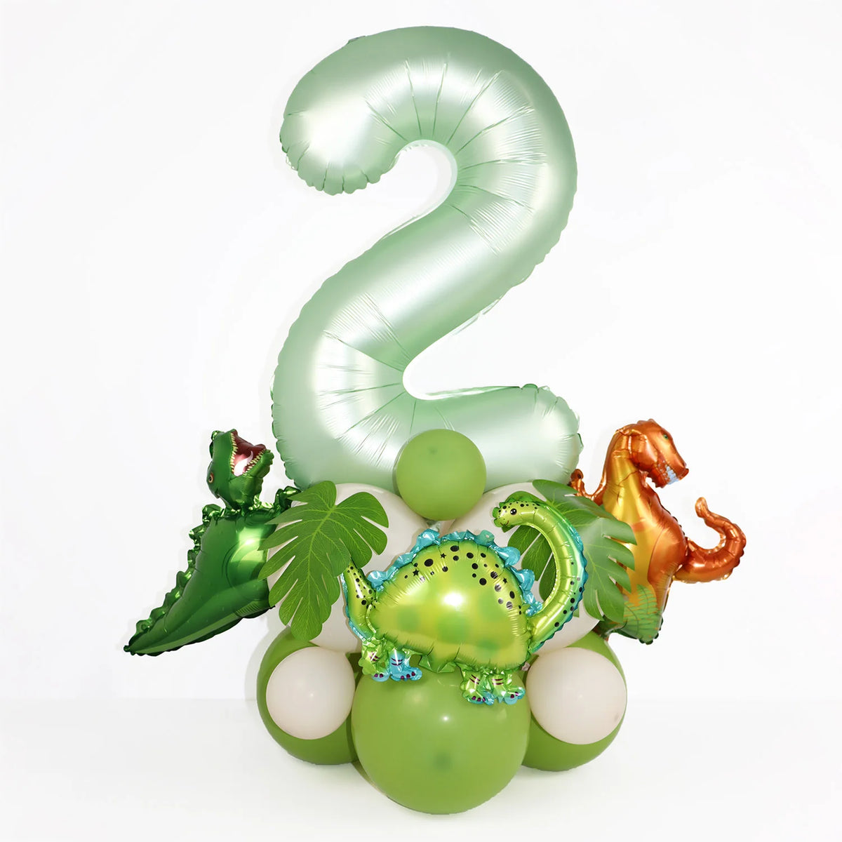 A large, light green foil number 2 balloon surrounded by various dinosaur-themed balloons.