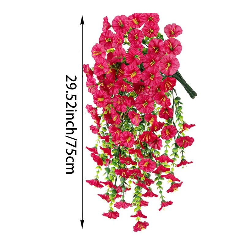 A vertical display of vibrant pink silk morning glory vine hanging flowers used for home decor.
