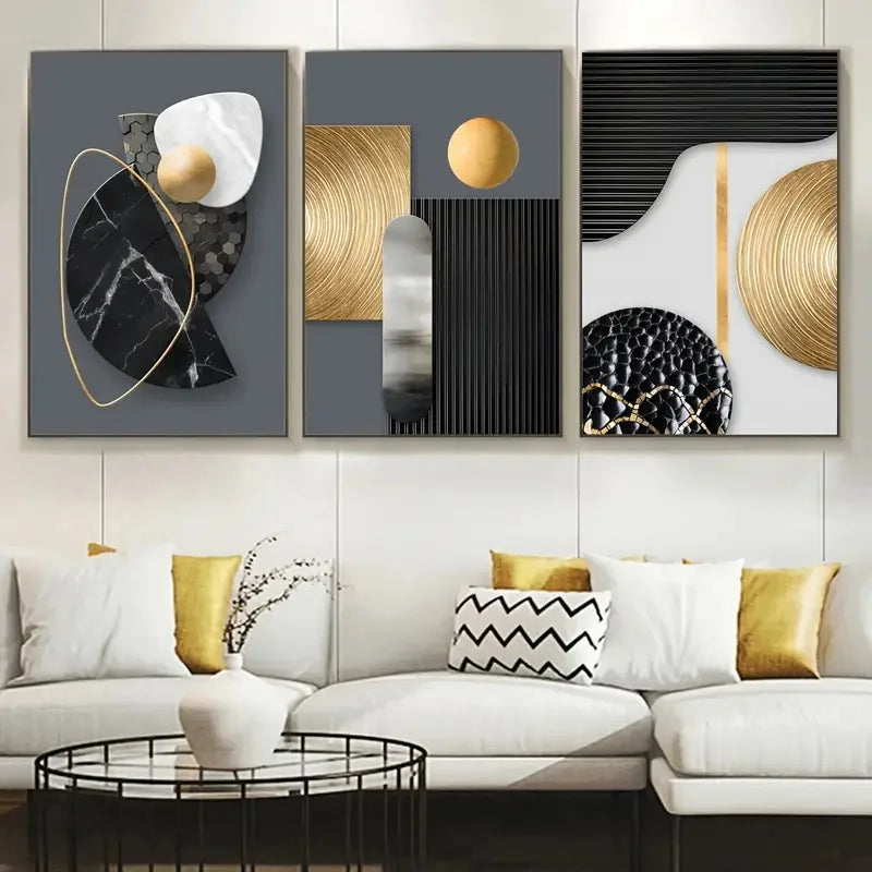 A set of three abstract canvas art pieces featuring geometric shapes, marble textures, and gold accents displayed on a white 