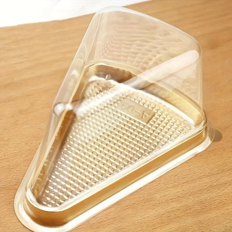 Clear disposable plastic cake slice containers with a perforated insert and a wooden stick.