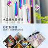 A set of seven crystal prism sun catchers hanging, showcasing various iridescent colors and light refraction.