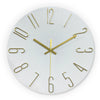 A round modern wall clock with gold 3D numerals and a white face, showing the time.