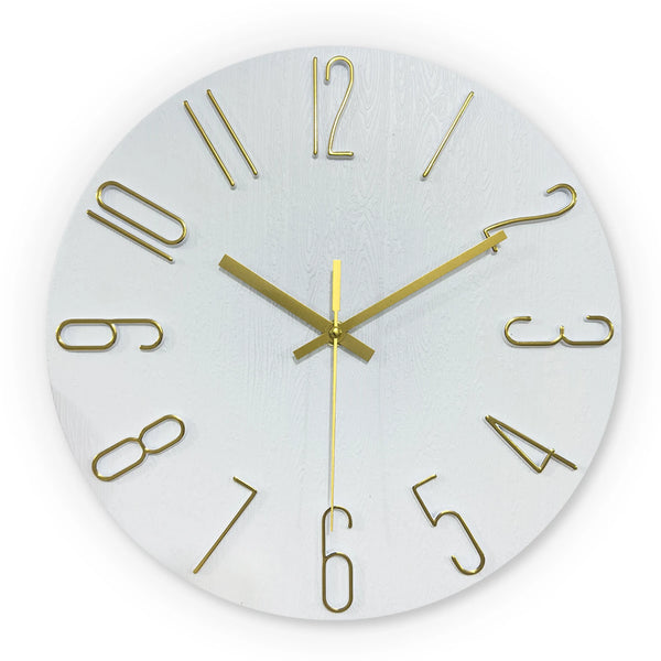 A round white wall clock with gold 3D numerals and hands displaying the time.