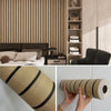 Roll of self-adhesive wood grain wallpaper in beige and black stripes.