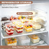 A display of 50 complete sets of clear plastic dessert cups with lids and spoons for refrigerator storage.