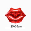 A pair of glossy red heart-shaped balloons with a foil finish.