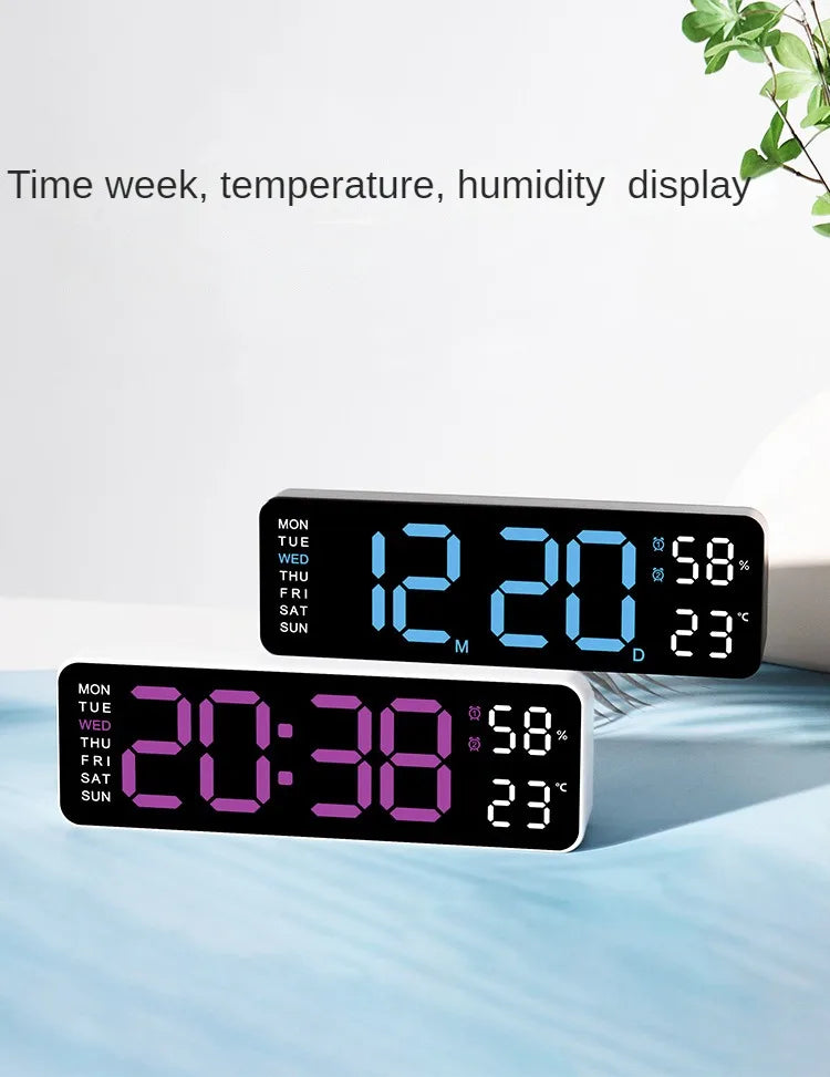 A digital wall clock displaying time, temperature, and humidity on a light blue surface.