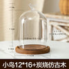Glass aromatherapy candle holder with a clear dome and a wooden base