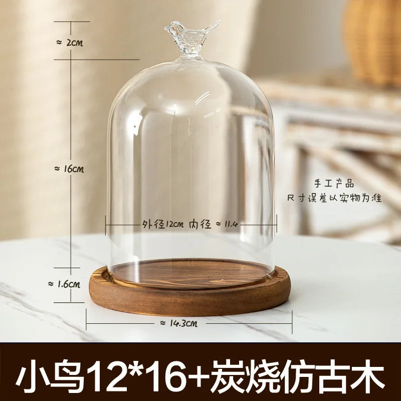 Glass aromatherapy candle holder with a clear dome and a wooden base