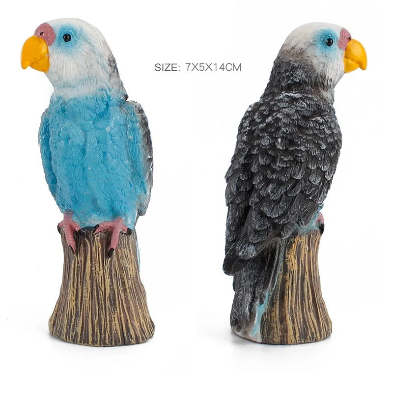 A hand-painted resin parrot figurine with blue and white feathers perched on a wooden base.