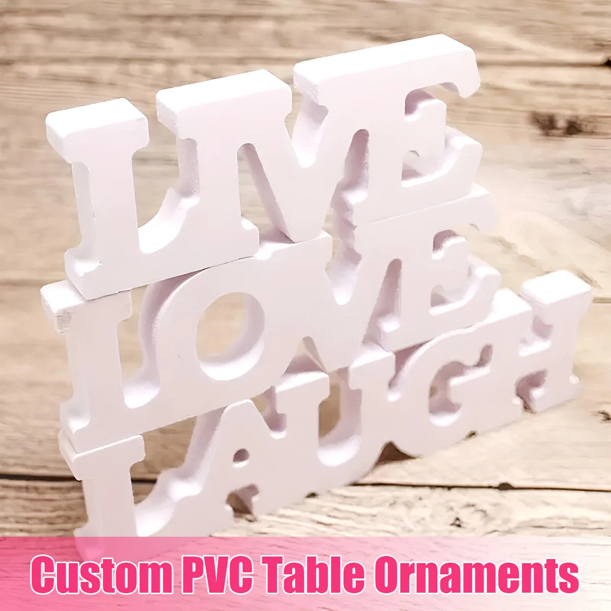 White PVC table ornaments shaped like the words LIVE LOVE LAUGH