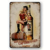 Vintage beer metal tin sign featuring a woman in red attire next to a bottle of spiced rum