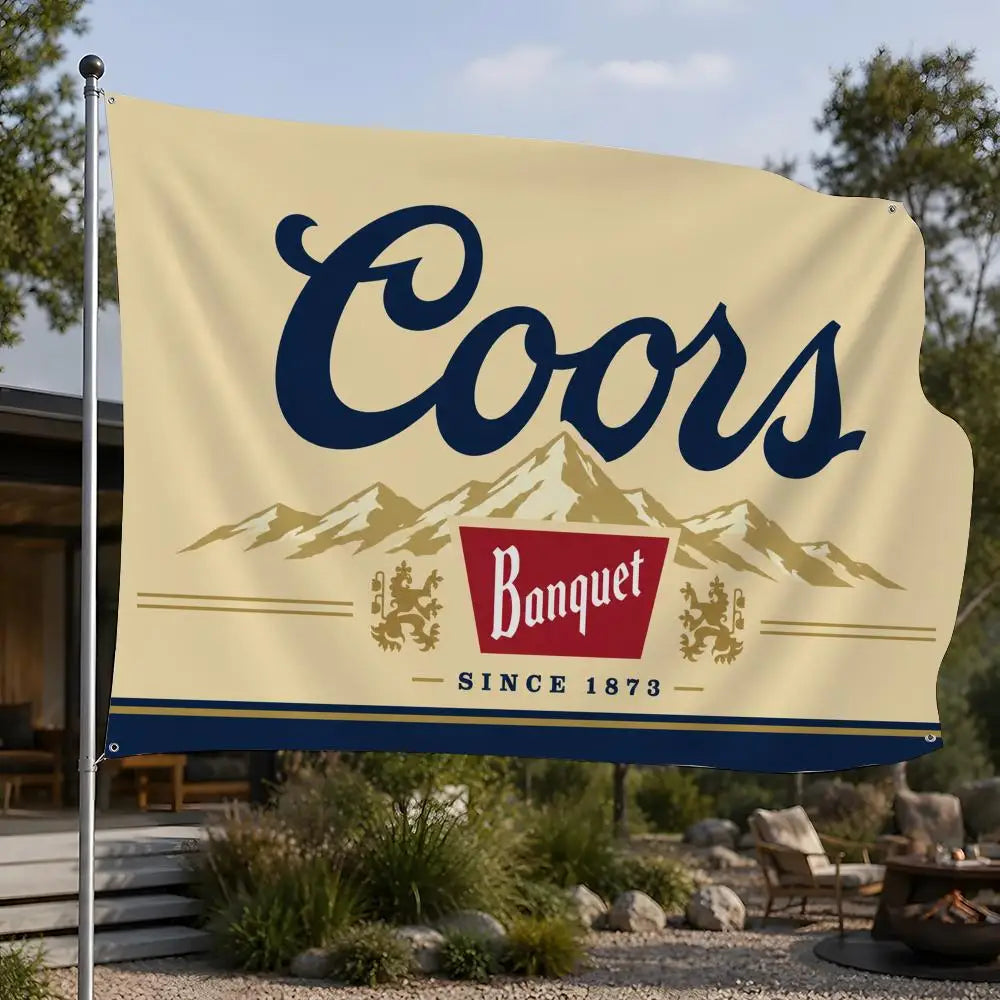 A beige flag banner with the word Coors in dark blue script above a silhouette of mountains and a red banquet logo.