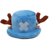 A blue plush knit cap resembling a fedora with brown accents and a silver cross design.