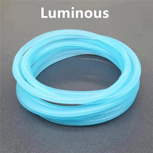 A set of ten luminous, translucent blue silicone bracelets arranged in a circle.
