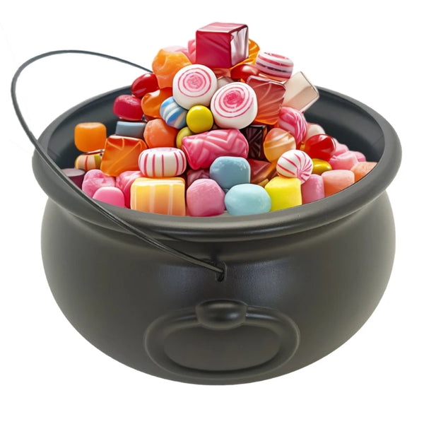 A black cauldron bowl filled with colorful, round candies and jellies.