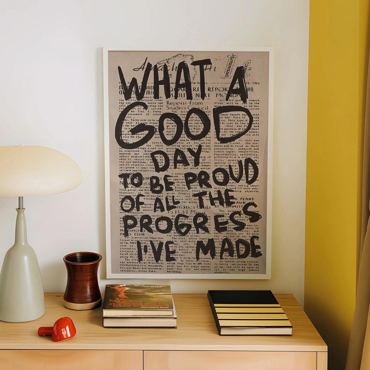 A framed canvas print featuring text from a vintage newspaper titled What a Good Day to be proud of all the progress I've mad