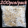 A package of 200 pieces of gold frosted snowflake confetti for holiday decorations.