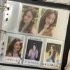 A photo card binder displaying several K-Pop idol photos with soft lighting and natural makeup.