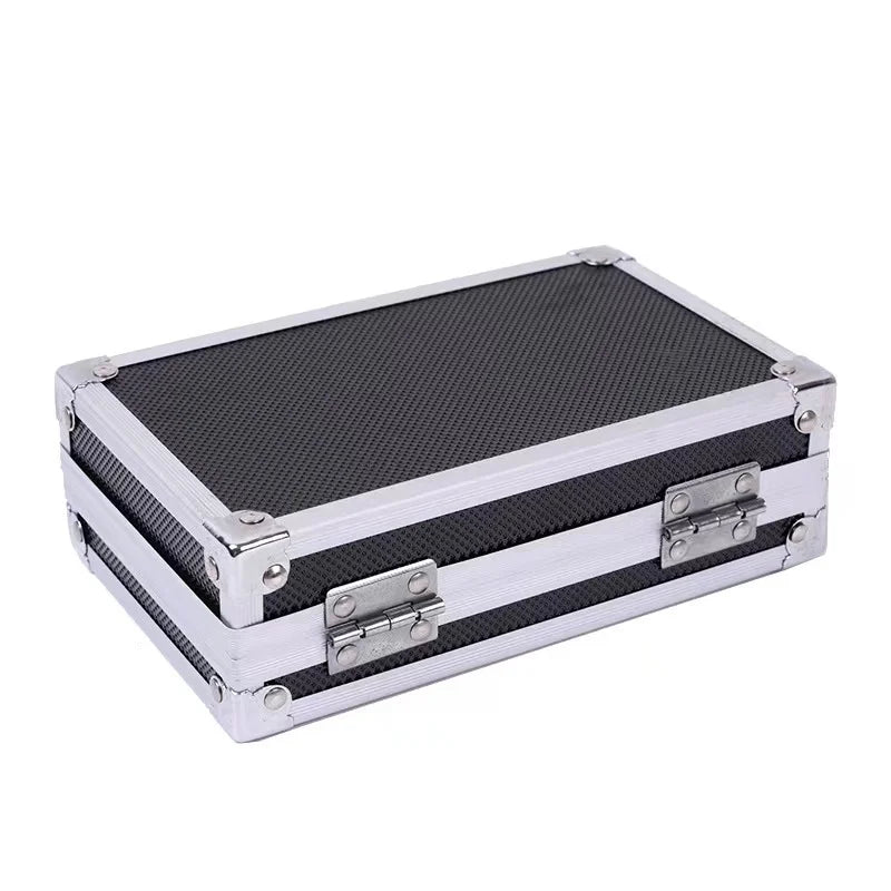 A silver aluminum storage box for a portable tattoo machine with reinforced corners.