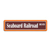 An orange rectangular metal sign with the text Seaboard Railroad BLVD.
