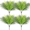 A pair of realistic artificial palm trees with vibrant green silk leaves.